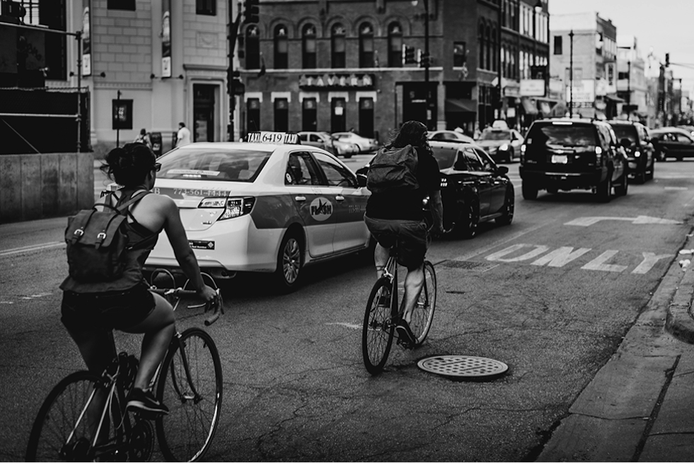 Cars and cyclists in traffic